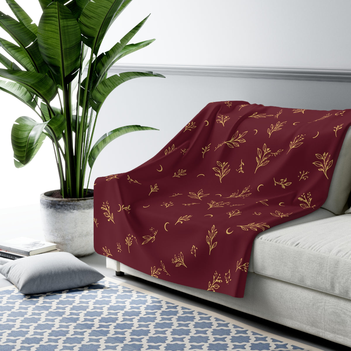 Cranberry Gold sherpa blanket draped over a sofa (larger size)