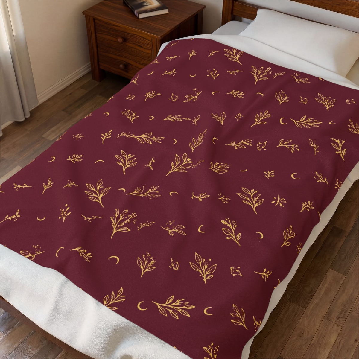 Cranberry Gold plush blanket spread across a bed