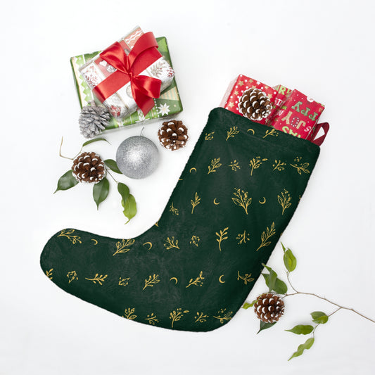 Botanical Gold Christmas stocking with wrapped gifts and pine cones