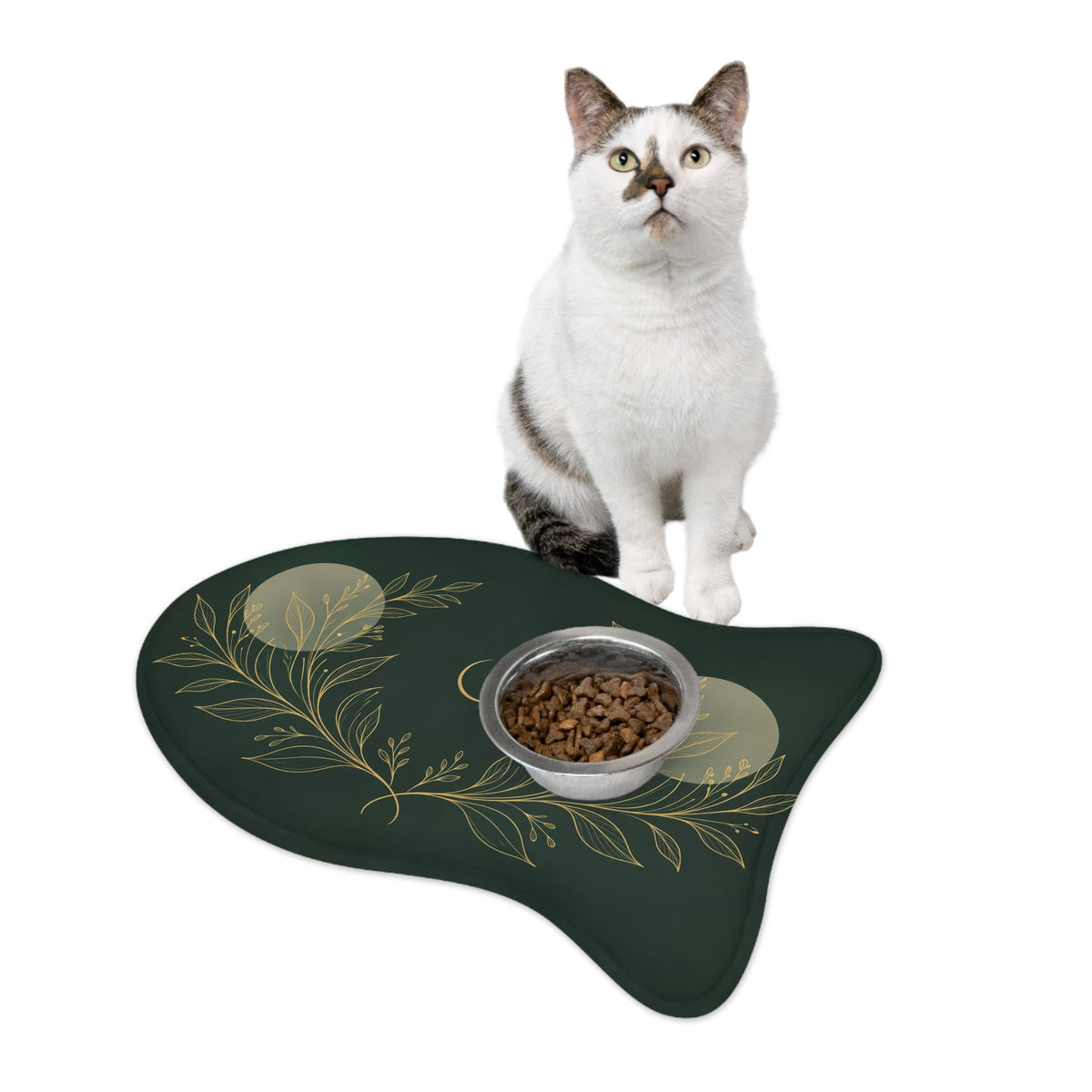 Cat sitting by a food bowl on the Botanical Gold fish-shaped feeding mat