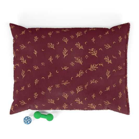 Cranberry Gold pet bed, 40" × 30": cranberry red with gold botanical sprigs and crescent moons
