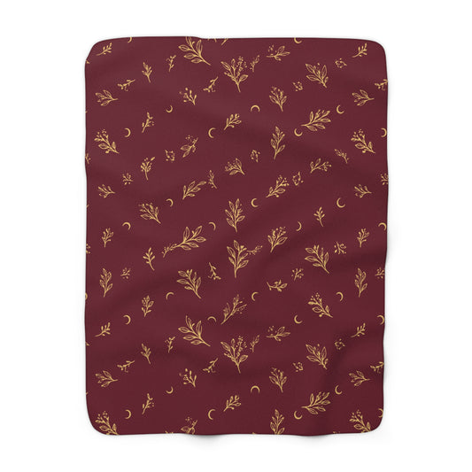 Cranberry Gold sherpa blanket, 50" × 60": cranberry red with gold botanical sprigs and crescent moons