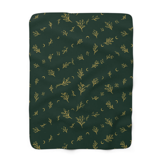 Botanical Gold sherpa blanket, 50" × 60": deep green with gold botanical sprigs and crescent moons