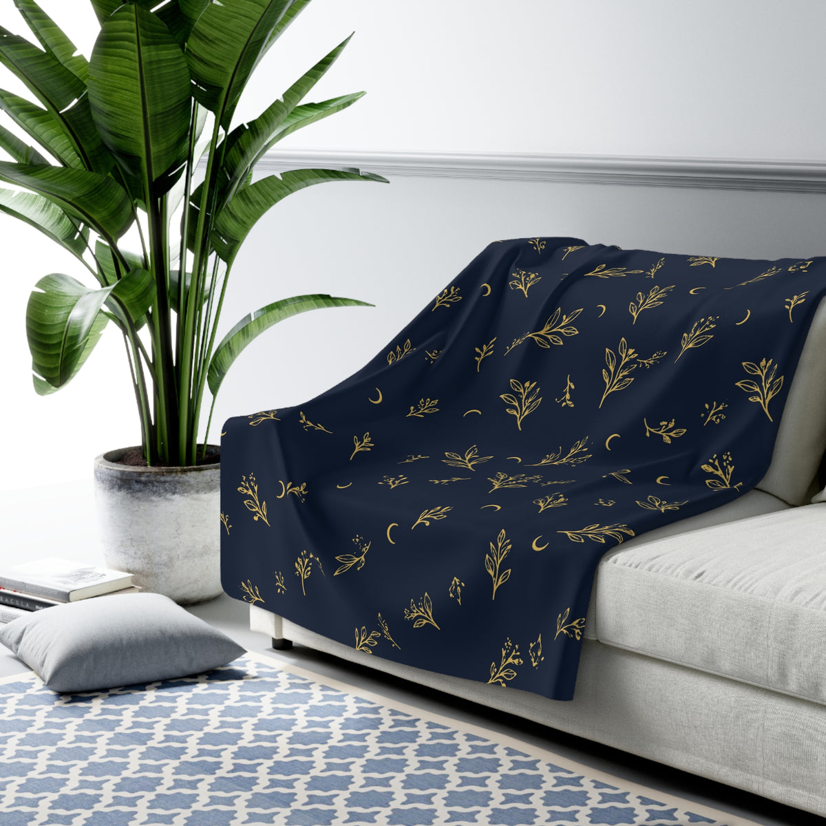 Navy Gold sherpa blanket draped over a sofa (larger size)