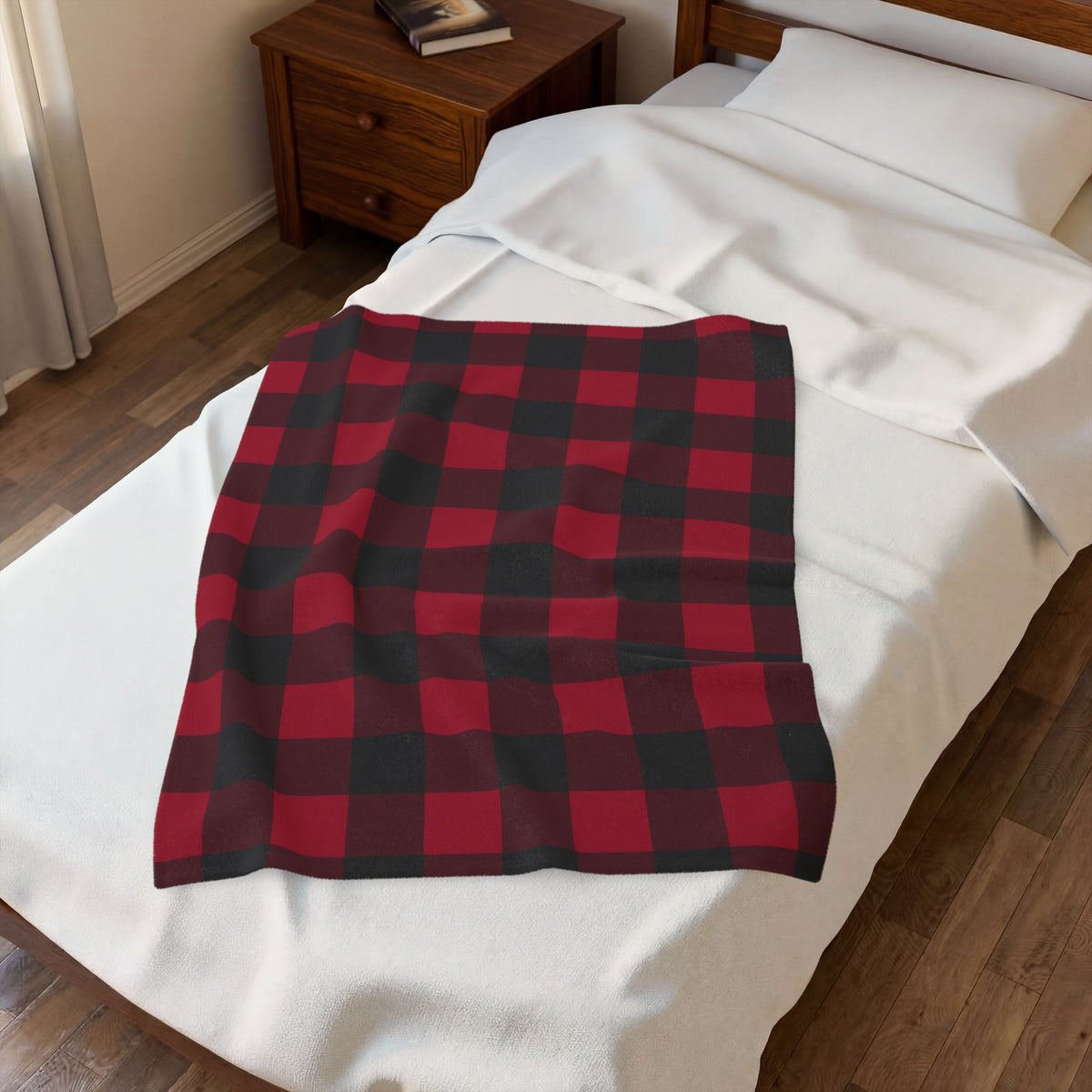 Cranberry Buffalo Check plush blanket laid on a white bed, seen from above