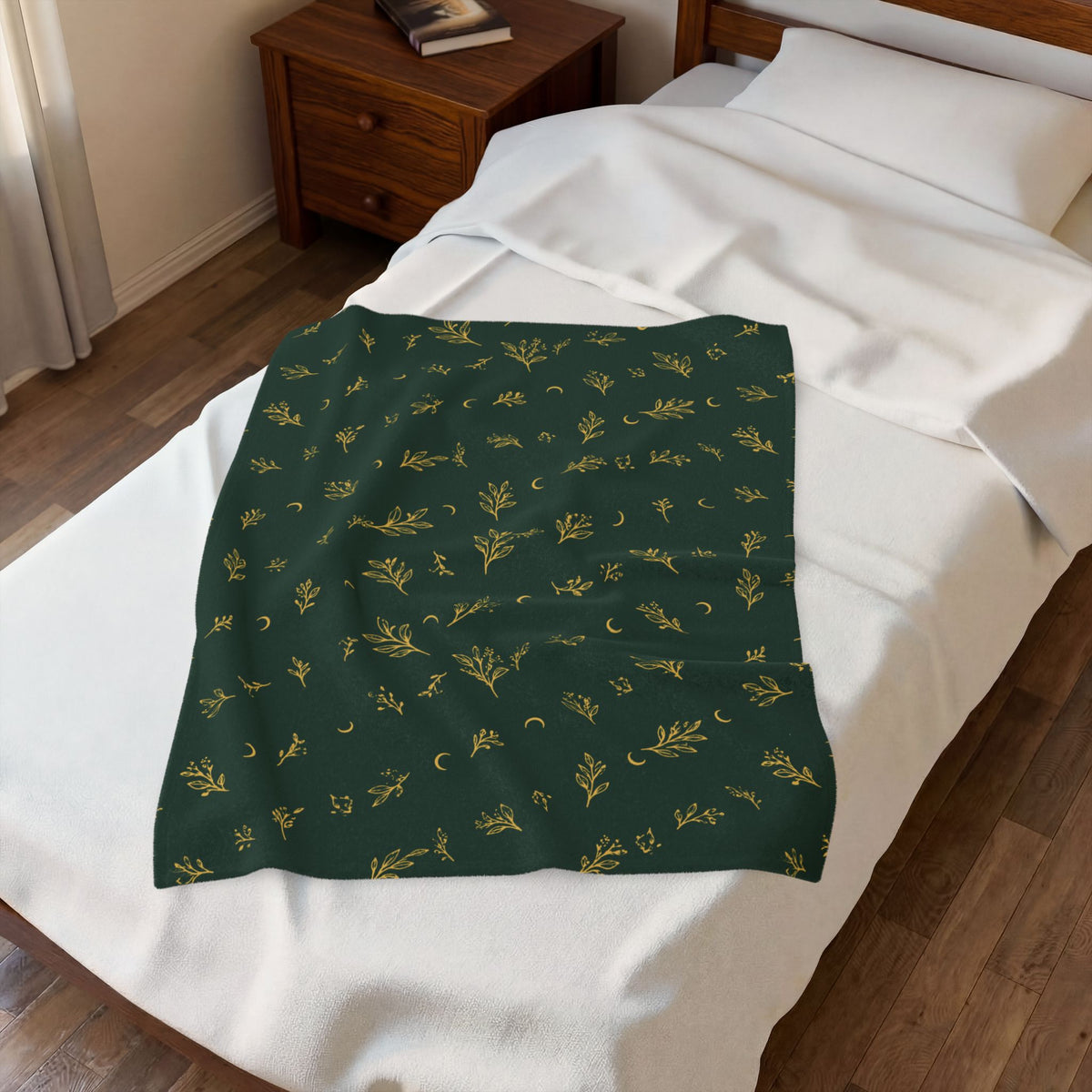 Botanical Gold plush blanket laid on a white bed, seen from above