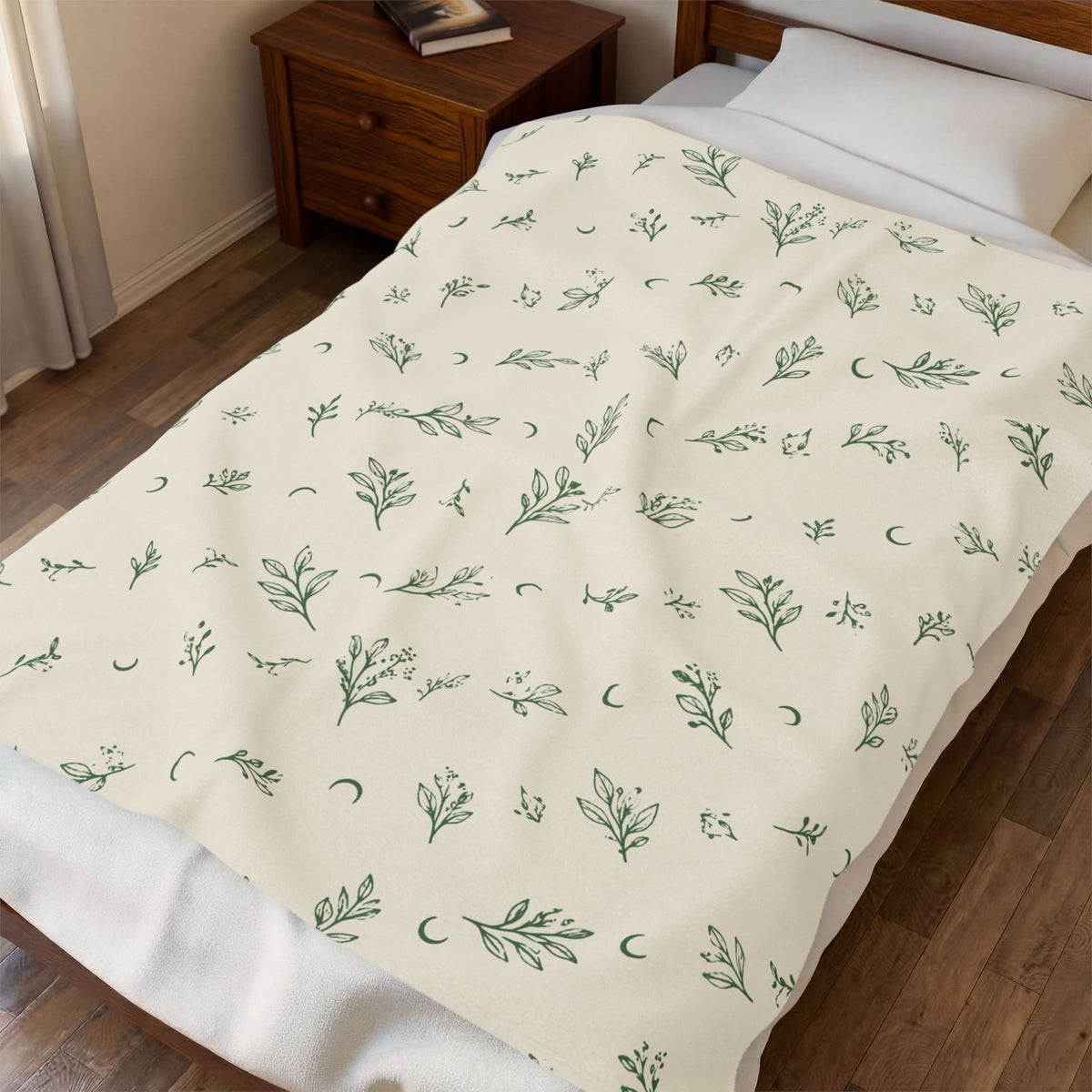 Cream Sage plush blanket spread across a bed